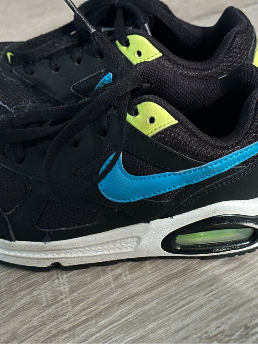 Nike Kids Black Sneakers with Blue Swoosh and Neon Yellow Accents